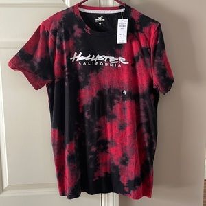 Brand New Men’s Hollister T-shirt. Size Medium. Color Red and Black.